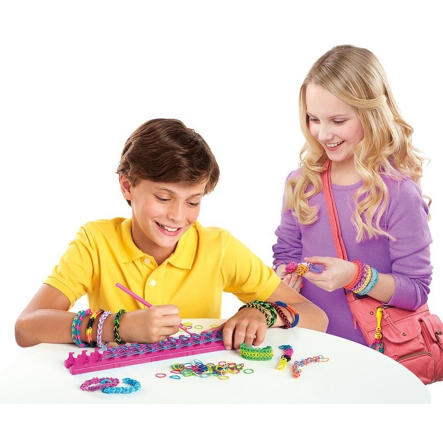Kids using rubber band loom set on table, weaving colorful rainbow bands