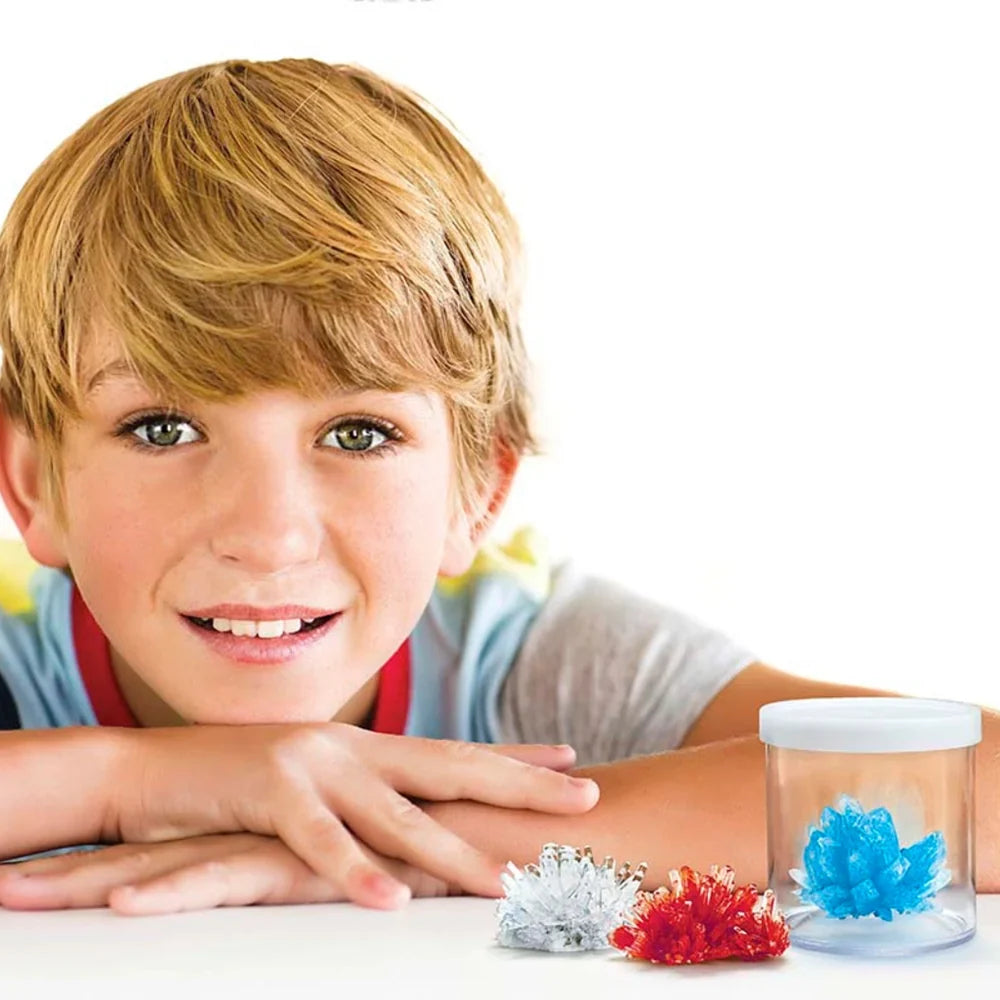 Child playing with crystal growth kit pieces in front of a clear jar