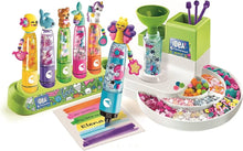 Highlighter studio set with green dispenser, colorful ink bottles, and markers
