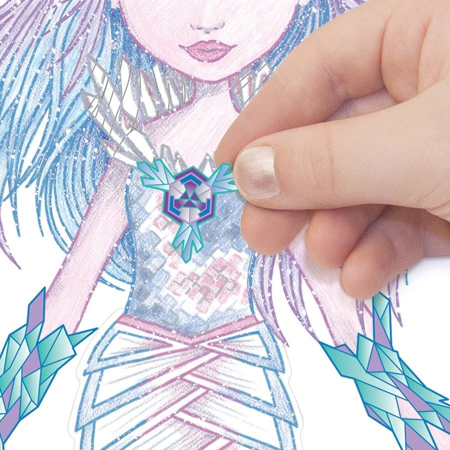Glittery geometric crystal sticker on a blue illustrated character page, held by fingers