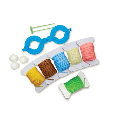 Pom pom making kit tools with colorful yarn strands and pom pom form pieces