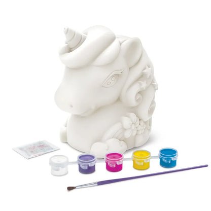 Unpainted white unicorn bank with paint pots and brush