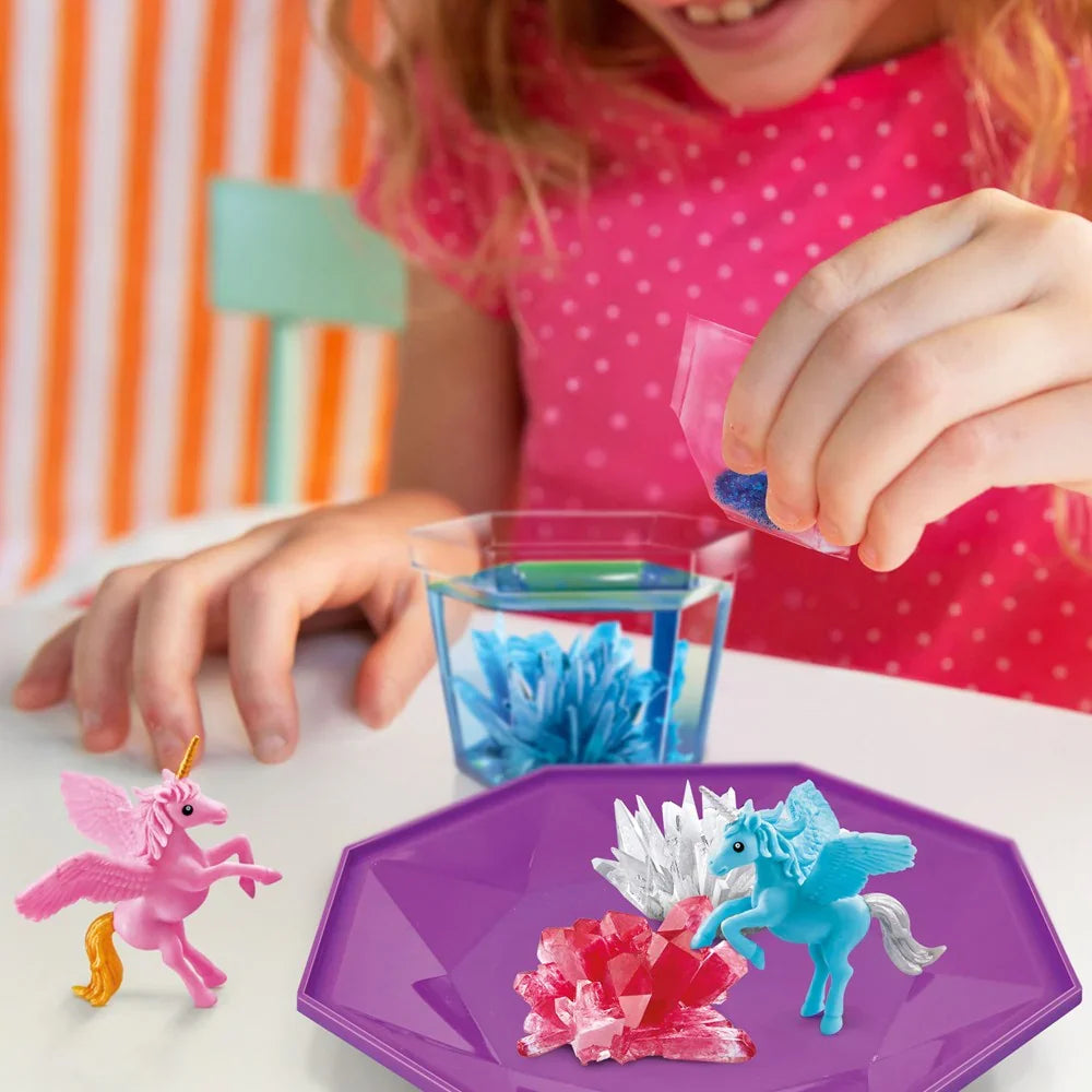 Purple faceted crystal terrarium tray with blue and pink unicorn figures and crystals