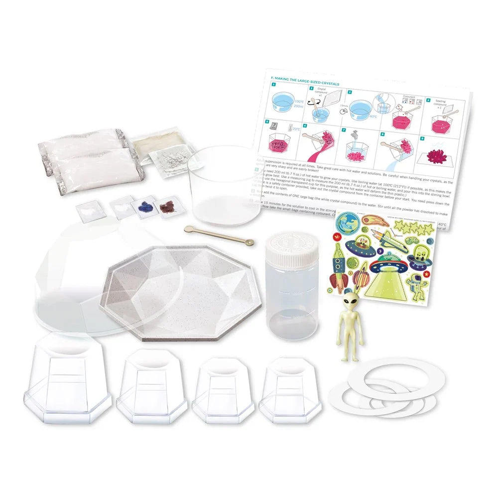 Crystal growing terrarium kit parts: octagon mold, bottles, crystal bags, tool, instructions