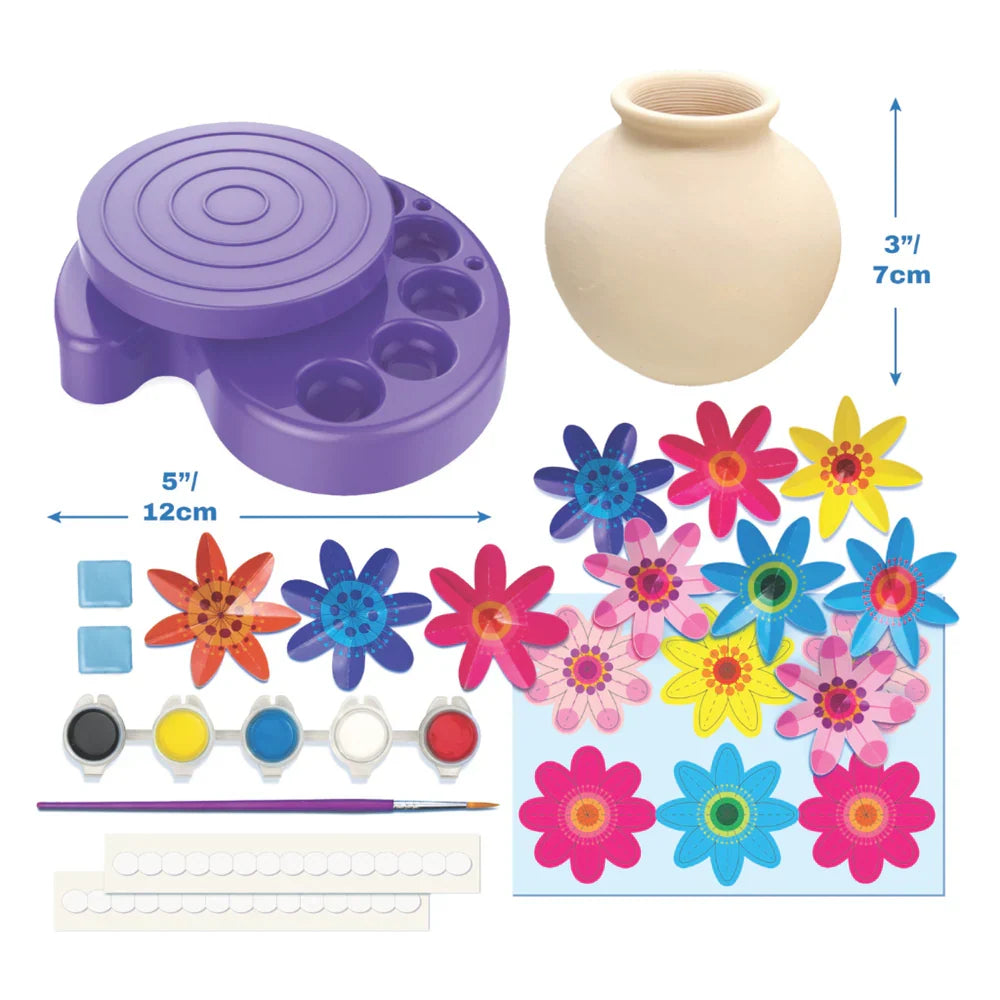 Mini vase craft kit parts: purple spinner base, blank vase, paint colors, flower pieces