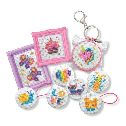 Mini cross-stitch buttons set with round stitched designs and metal key rings