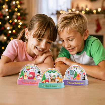 Three Christmas snow domes on table, children in background