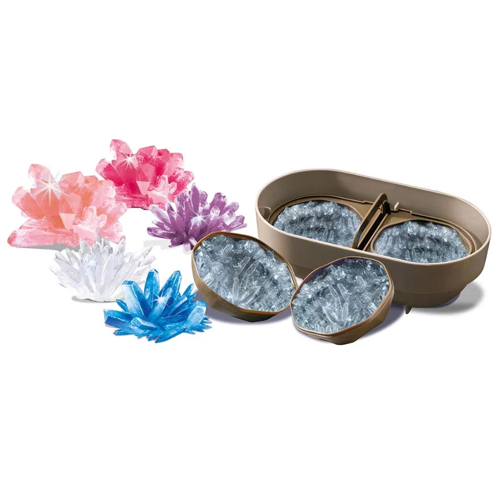 Crystal growing kit tray with blue, pink, purple, and white crystal pieces