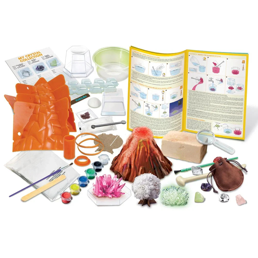 Kids science experiment kit contents: volcano pieces, tools, crystals, molds, and gloves