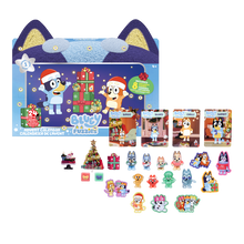Bluey Puppets Christmas advent calendar set with a large blue cat-shaped box, four character cards, and multiple small character stickers and accessories arranged on a white background.