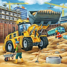 Construction vehicle jigsaw puzzle artwork with yellow wheel loader and workers