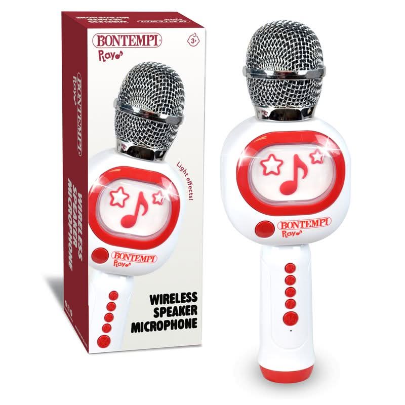 A white and red wireless microphone speaker toy shown next to its retail box on a clean white background. The toy features a silver mesh microphone head, red star and music note graphics on the front, and red control buttons on the handle.
