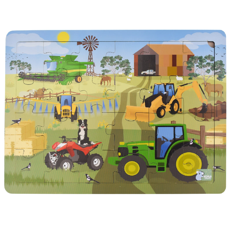 Farm vehicles jigsaw puzzle, finished scene with tractor, loader, and barn