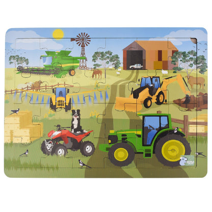 Farm vehicles jigsaw puzzle, finished scene with tractor, loader, and barn